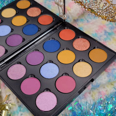 Eyeshadow palette with various colors in round pans, black case, and reflective finish
