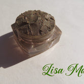 Eyeshadow pigment in brown shimmer, with Lisa Mae text on white background and clear jar