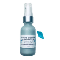 Eye cream bottle with blue glass, silver cap, and Navoms Beauty label