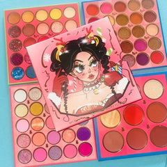 Eyeshadow palette with multiple colors, glitter, and Kevin&Coco brand name for makeup