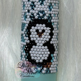EOS lip balm with white, black, and blue crystal penguin pattern, Lily Vine Creations logo visible