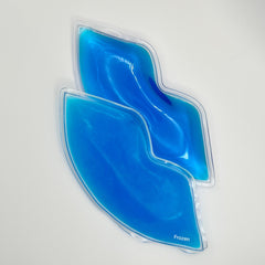 Lip-shaped gel pack with blue liquid and clear plastic frame, brand "Frozen" visible