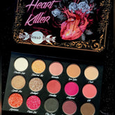 Eyeshadow palette with multiple colors, black case, and Spellbound Beauty branding
