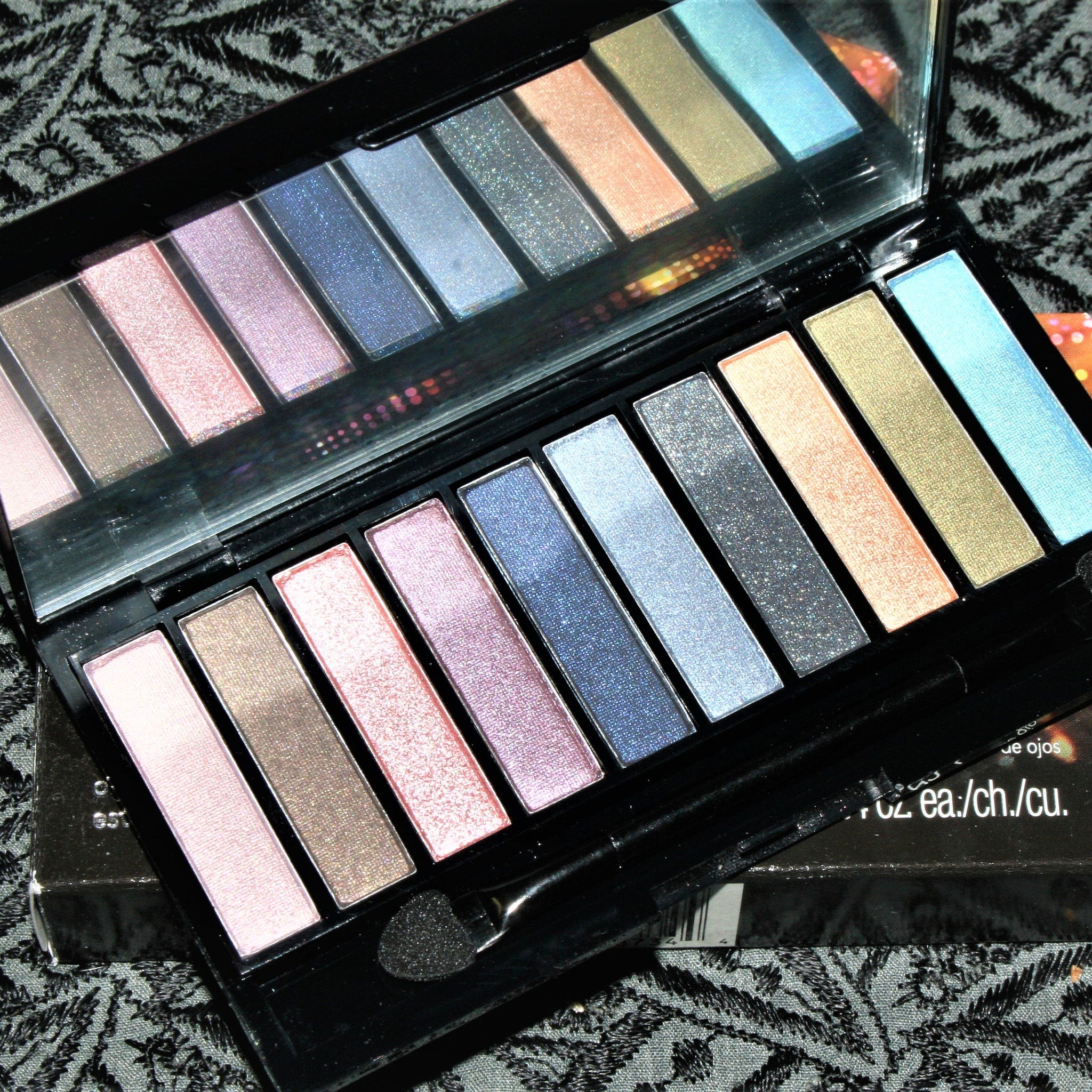 Vintage Avon Luxe Clutch eyeshadow compact with gold-trimmed rectangular case and floral pattern