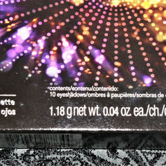 Side view of vintage Avon Luxe clutch eyeshadow compact showing gold-trimmed edges and snap closure