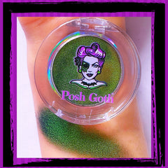 Close-up of absinthe green multichrome eyeshadow with metallic shifting hues and smooth shimmer finish