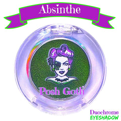 Side angle of absinthe green multichrome eyeshadow pan catching light with metallic shift
