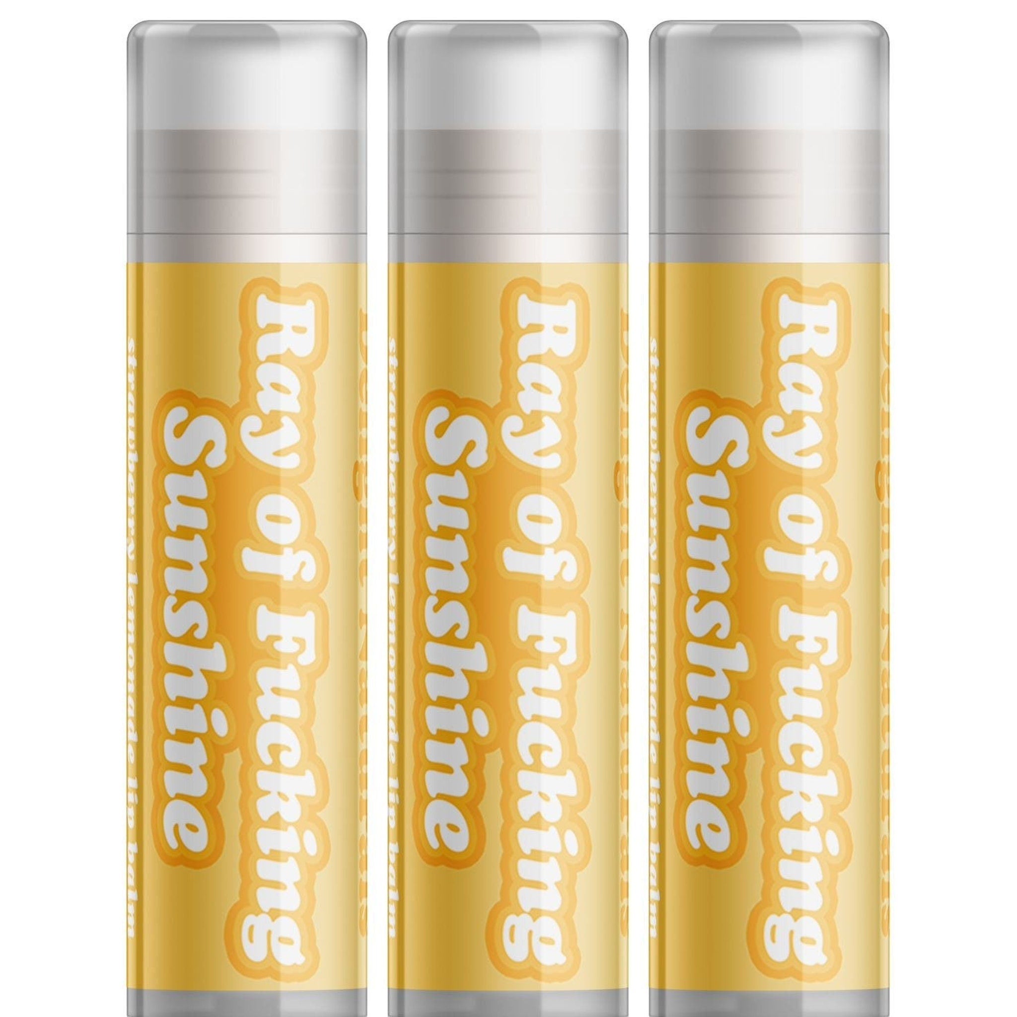 Lip balm tubes in yellow with white text, clear cap, Delight Naturals "Ray of Sunshine