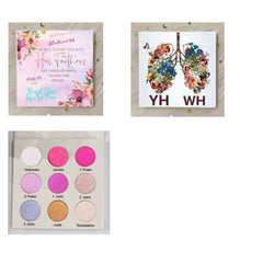 Eye shadow palette with pink, gold, and blue shades, in a rectangular case, for makeup application