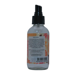 Spray bottle with black pump, clear glass, and floral label from Mountain Valley Botanics