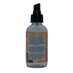 Hydrosol spray bottle with black cap, clear glass, and floral label for aromatherapy