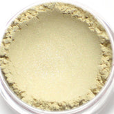 Eyeshadow cream in ivory white with shimmer, in a clear container