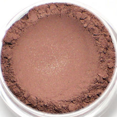 Eyeshadow powder in brown, matte finish, with glitter specks in a clear container