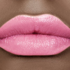 Lip gloss, pink glossy lips with skin texture visible, close up view of mouth