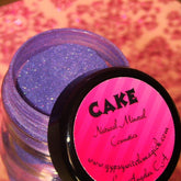 Compact case of Natural Mineral Purple Eye Shadow by TEMPTATION with smooth matte finish and deep violet hue