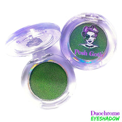 Hand applying absinthe green multichrome eyeshadow with fingertip, showing metallic shift on eyelid