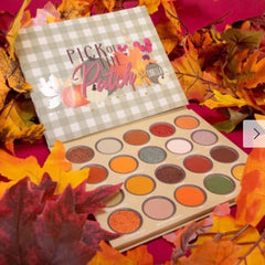 Eye shadow palette with gingham pattern, fall colors, and Lurella brand name visible.