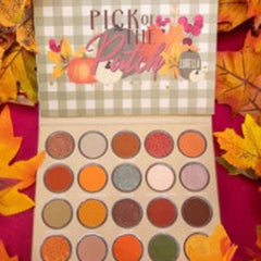 Eyeshadow palette with fall colors and "Pick of the Patch" text on a checkered background