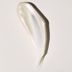 Cream swatch with pearlescent finish, light color, and smooth texture on white background