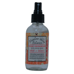 Rose Geranium hydrosol spray bottle, clear glass, black spray top, Mountain Valley Botanics label