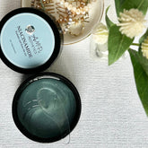 Translucent blue jar of hydrating eye jelly mask with minimalist silver lid and smooth gel texture