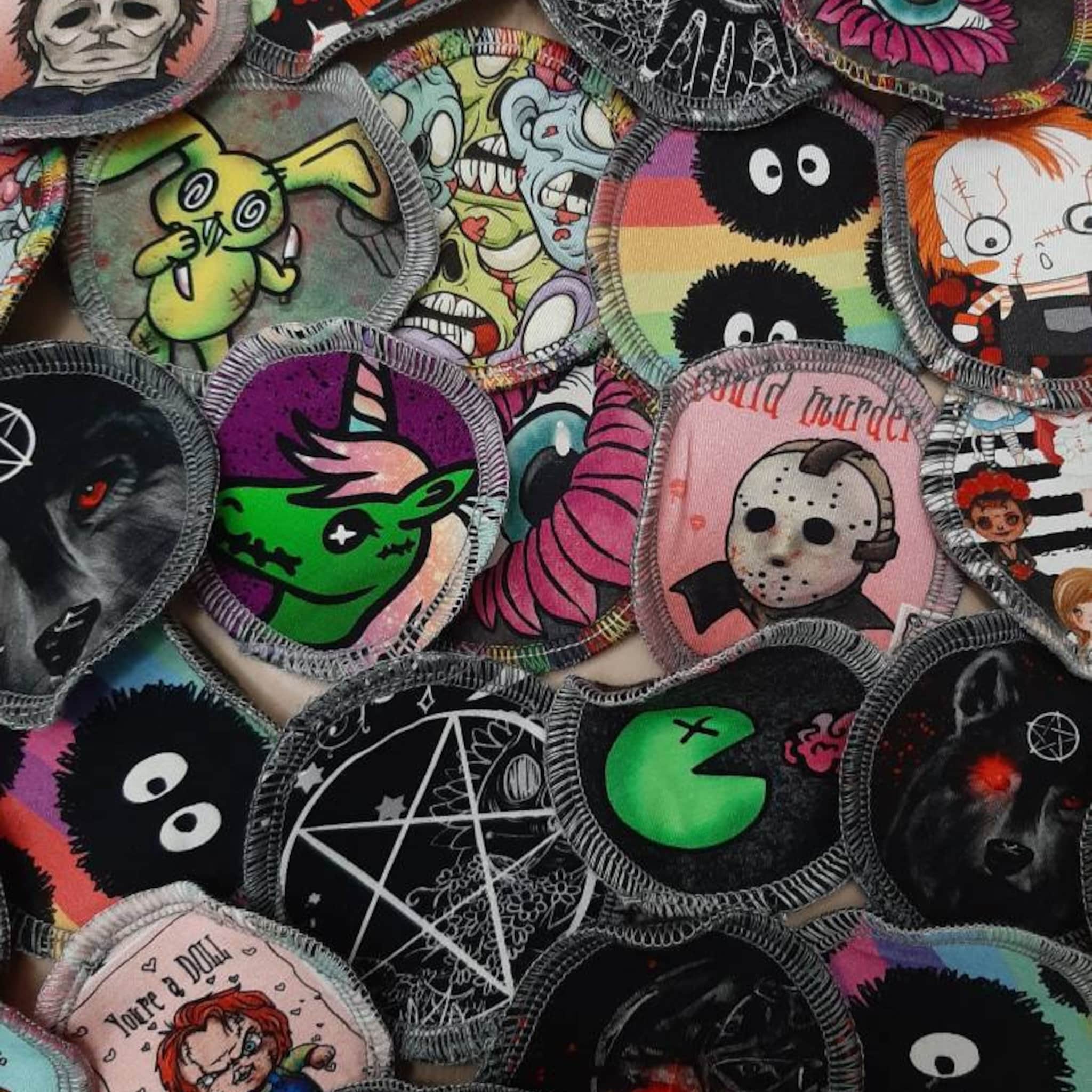 Reusable face wipes with various colorful horror character patterns and stitched edges