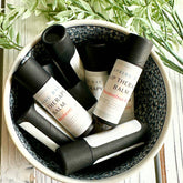 Lip Therapy Balm, black and white tubes, in a patterned bowl, Spring Day brand