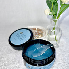 Side angle of translucent jelly eye mask in sleek white packaging with minimalist typography