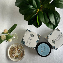 Close-up of cooling jelly eye mask applied beneath eyes, translucent gel shimmering on hydrated skin