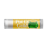Lip balm tube with gold, green, and white design, Delight Naturals Pot O' Gold label