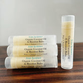 Lip balm tubes with white and light yellow, clear plastic, and frn krmer text visible