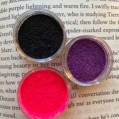 Close-up of Sorceress Eye Shadow Set showing rich matte and shimmer shades in deep plum, emerald, and bronze tones