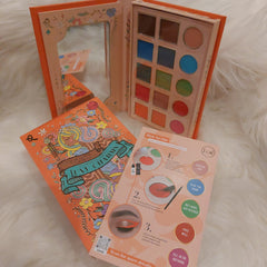 Eye makeup palette with colorful eyeshadows, orange packaging, and Jcats branding shown open