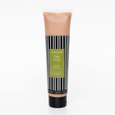 Facial cleanser tube with black and white striped pattern, tan scrub, and Scruff Rescue label