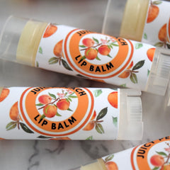 Lip balm tubes with peach fruit design and clear plastic caps ready for use