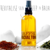 Facial Toner SAFFRON, yellow liquid in glass bottle, black spray top, ELIXIRIUM text