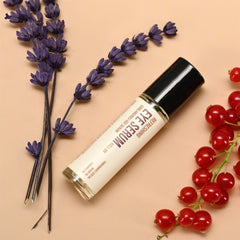 Eye serum roll-on bottle with black cap, beige label, and purple lavender sprigs on beige background