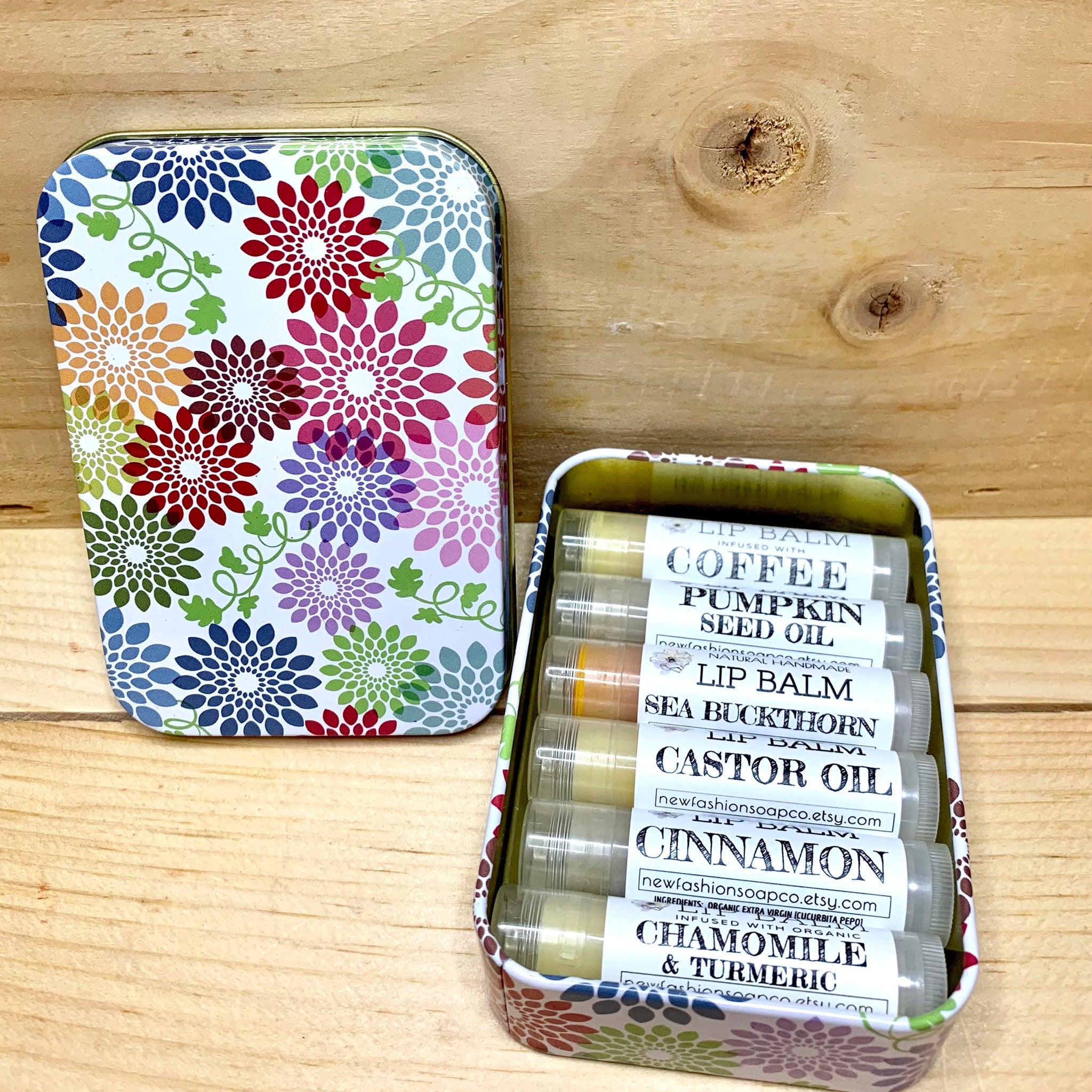 Lip balm set in metal tin with floral pattern, NEW FASHION SOAP Co. brand visible