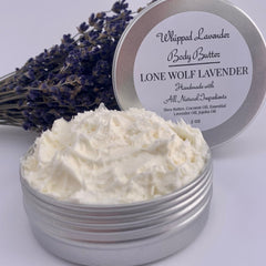 Side view of lavender whipped body butter in a sleek white jar with gold lid, showcasing its rich, creamy texture against dry skin.