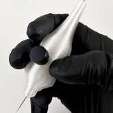 Silver 25mm handpoke skincare tool with smooth rounded tip for gentle facial treatments