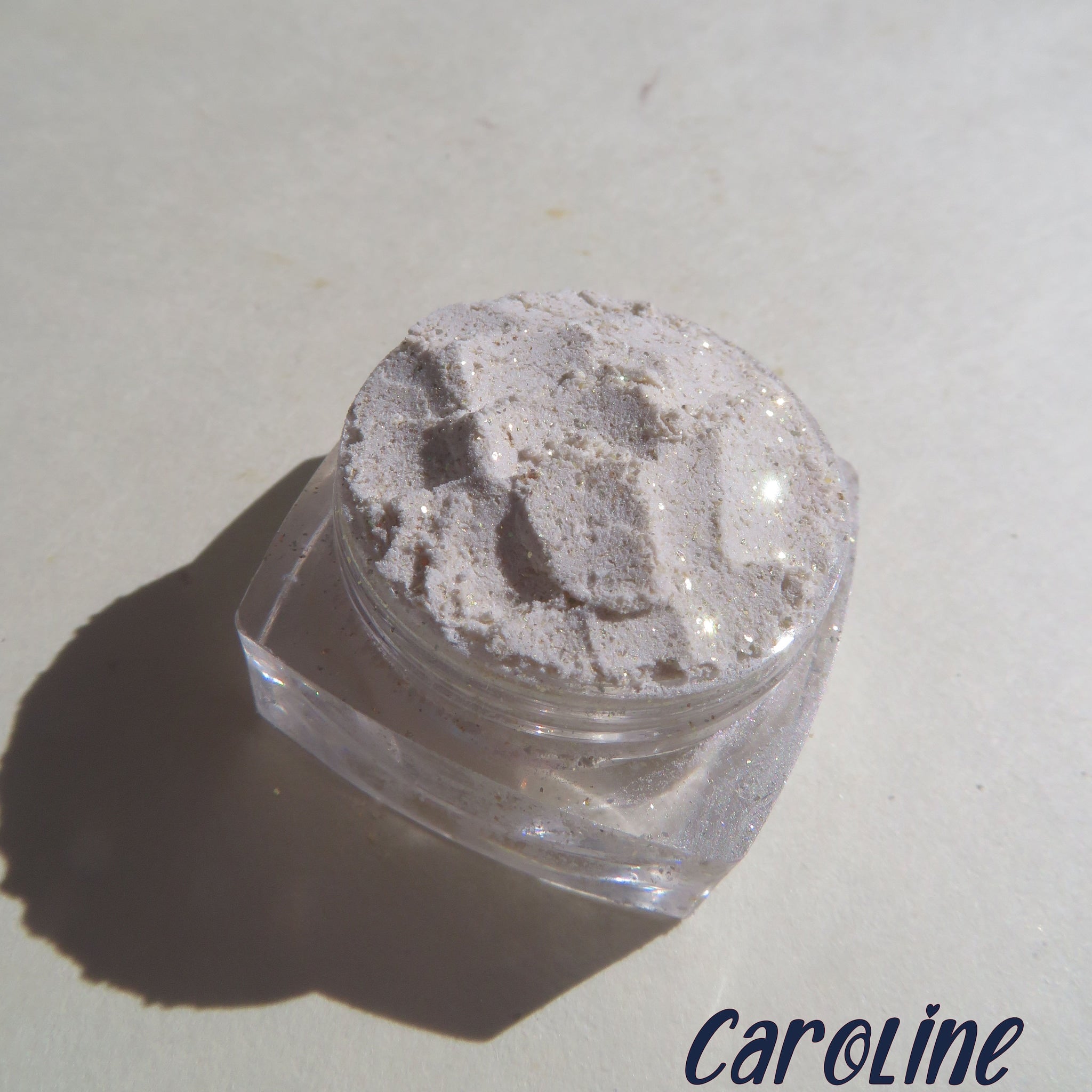 Eye shadow, white powder with gold sparkles, in clear jar, Caroline brand