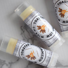 Lip balm tubes with yellow balm, plaid pattern label, and "Toasted Marshmallow" text