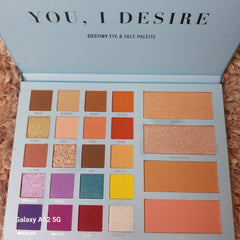 Eye and face palette with various shades of brown, orange, and pink colors, in a light blue case