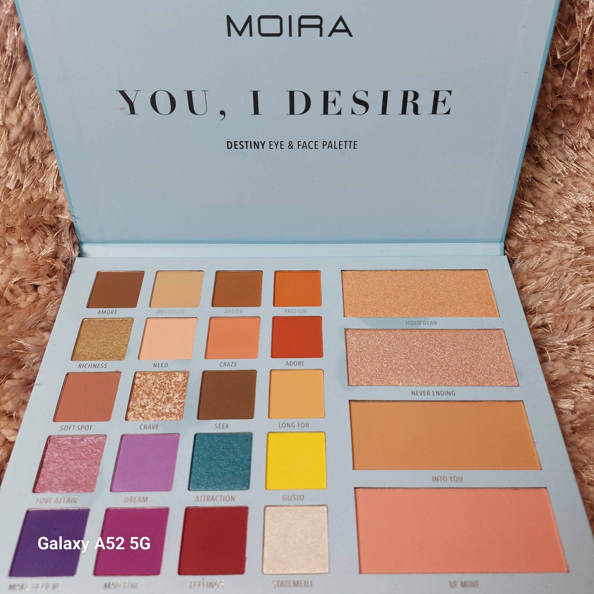 Moira Eyeshadow Palette featuring 12 vibrant matte and shimmer shades in a sleek black compact.