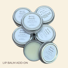 Lip balm tins with Belier Lavender labels, silver metal containers, and visible balm inside