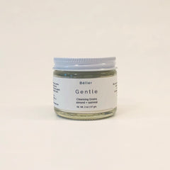 Cleansing grains jar with white lid, clear glass, and white label with text