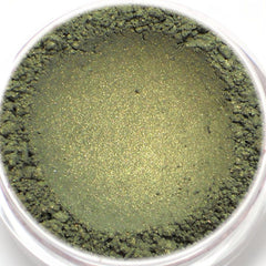 Green eyeshadow powder with shimmer and textured finish in a clear container