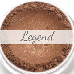 Close-up of Legend Bronze Brown mineral eyeshadow sample in compact with shimmering warm bronze-brown tones