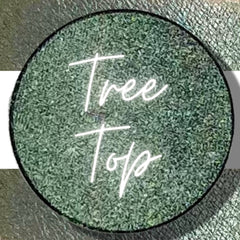 Close-up of vegan pressed eyeshadow single pan showing smooth matte texture in compact 26mm case