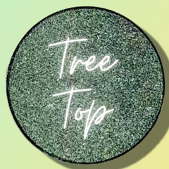 Side view of vegan pressed eyeshadow single pan in 26mm compact showing smooth matte texture and edge details